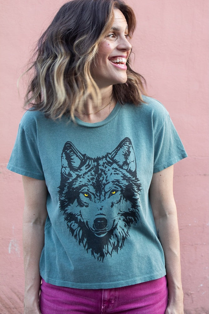 the "mother wolf" graphic tee on vintage green